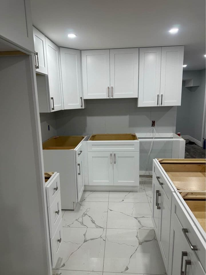 White shaker cabinet kitchen by K&M Kitchen Renovations