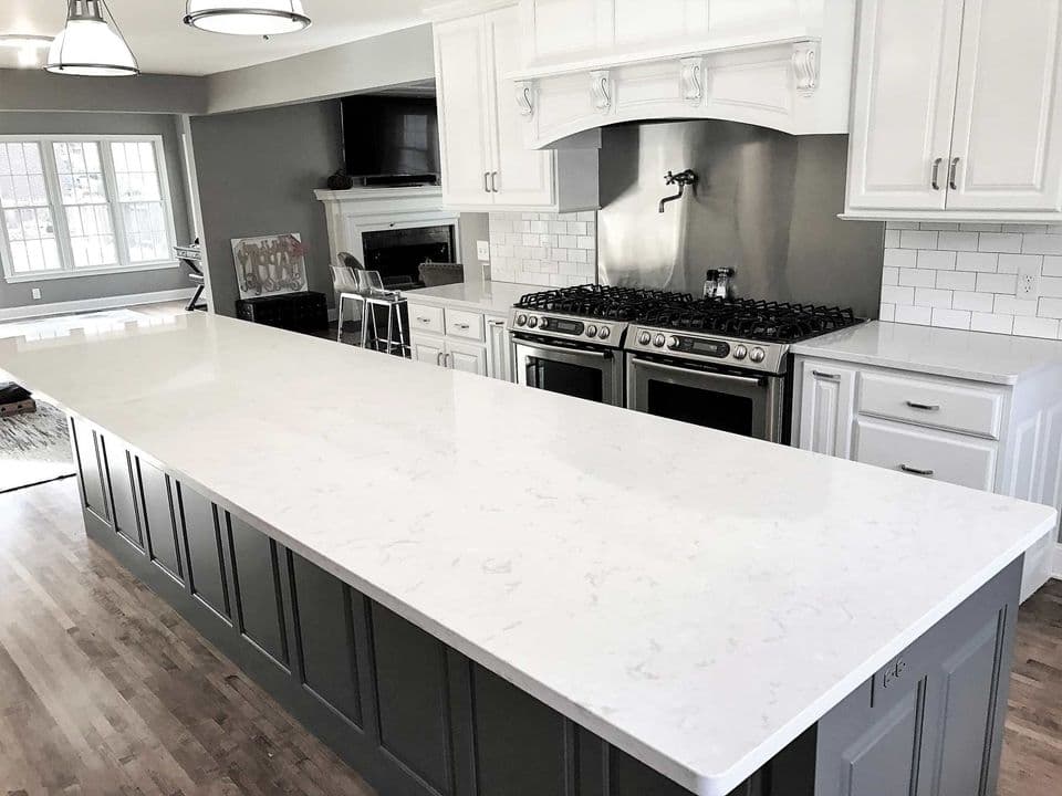 Contemporary kitchen remodel with waterfall island countertop